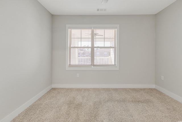 unfurnished room featuring carpet flooring