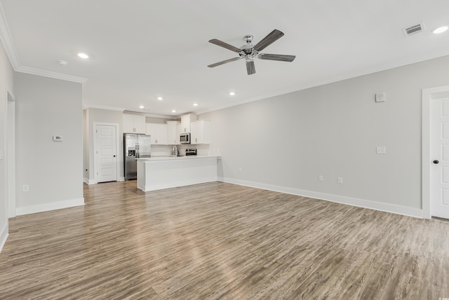 unfurnished living room with light hardwood / wood-style flooring, ceiling fan, and crown molding