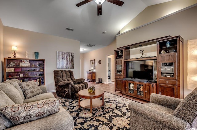 living room with hardwood / wood-style floors, vaulted ceiling, and ceiling fan