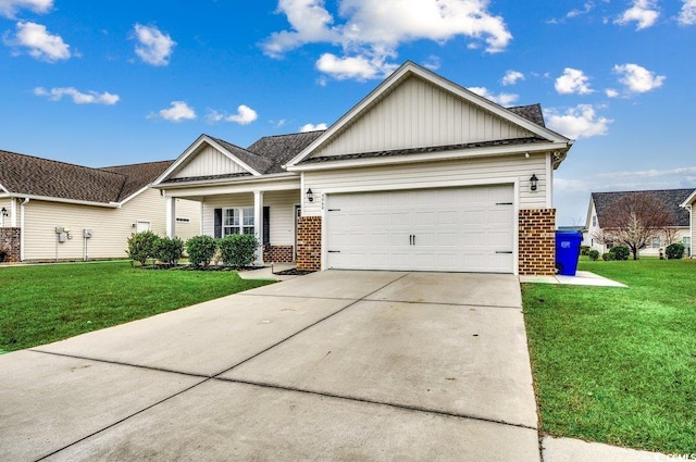 view of front of home featuring a front yard and a garage