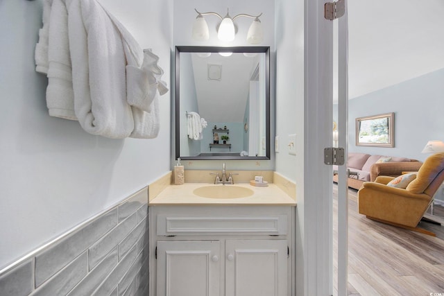 bathroom with vanity and hardwood / wood-style flooring