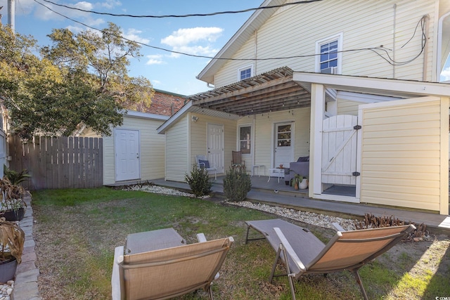 back of house with a yard