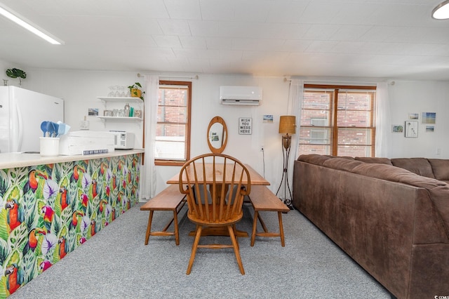 dining room with carpet floors, plenty of natural light, and a wall mounted AC