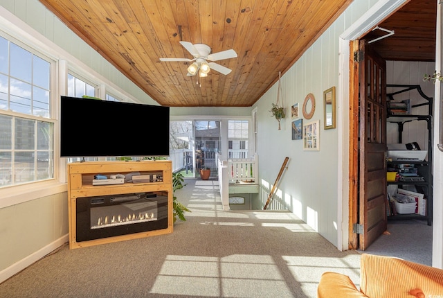 sunroom / solarium with ceiling fan and wooden ceiling