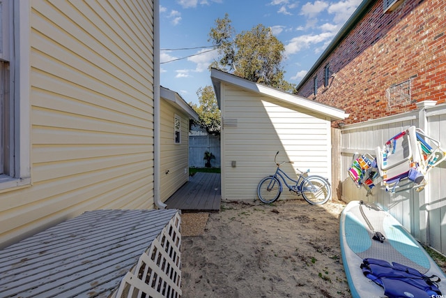 view of property exterior featuring a wooden deck