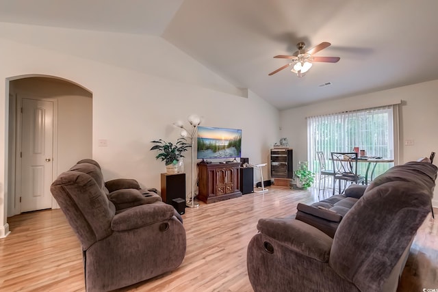 living room with vaulted ceiling, light wood-type flooring, and ceiling fan