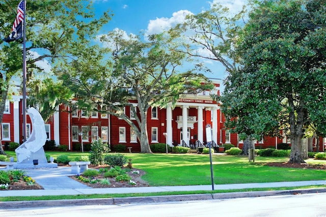 view of community with a yard