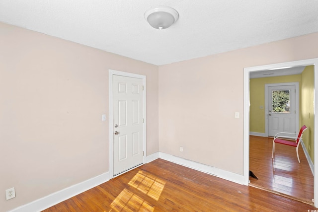 spare room featuring hardwood / wood-style floors