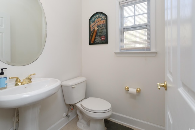 bathroom featuring toilet and tile patterned floors