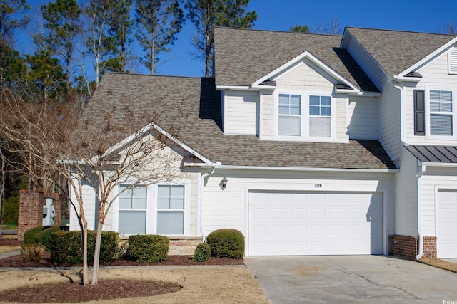 view of front of property with a garage