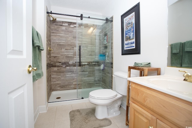 bathroom featuring tile patterned flooring, an enclosed shower, vanity, and toilet