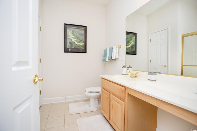 bathroom featuring toilet, tile patterned flooring, and vanity