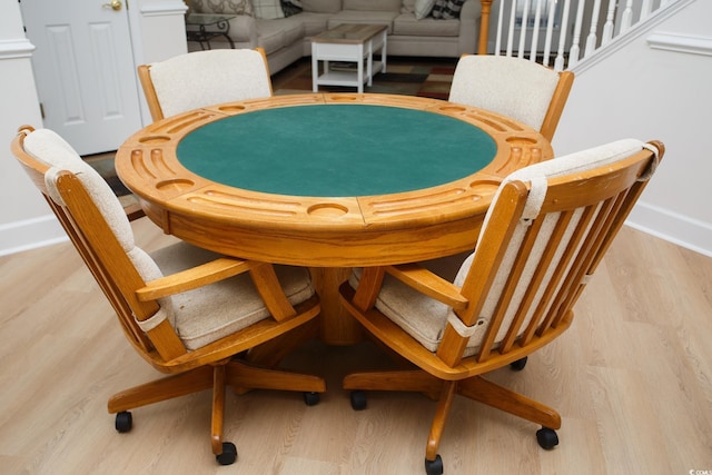 dining space featuring light wood-type flooring