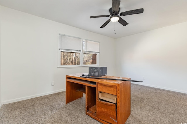 carpeted home office with ceiling fan