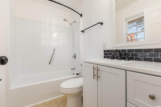 full bathroom featuring toilet, bathing tub / shower combination, decorative backsplash, tile patterned floors, and vanity