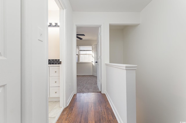 hallway featuring dark hardwood / wood-style flooring