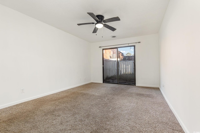 carpeted empty room with ceiling fan