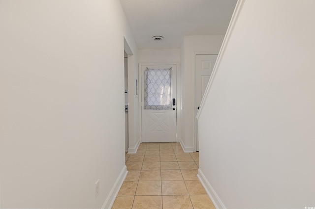 corridor featuring light tile patterned flooring