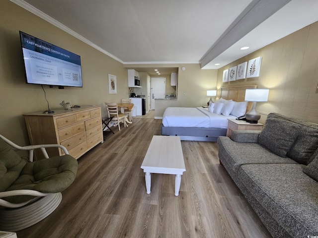 bedroom featuring dark hardwood / wood-style flooring and crown molding