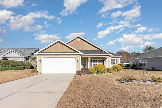 view of front of house featuring a garage and a front lawn