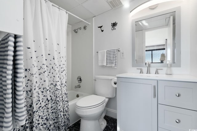 full bathroom featuring vanity, toilet, a paneled ceiling, and shower / tub combo with curtain