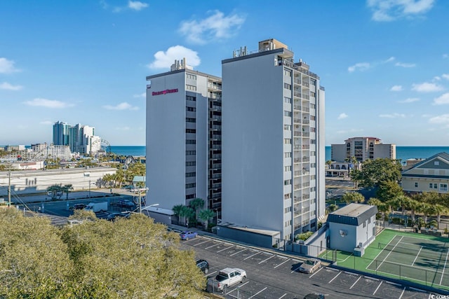 view of building exterior with a water view