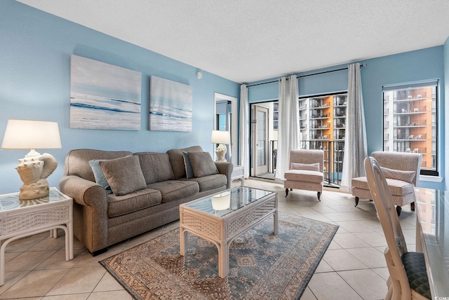 living room with light tile patterned floors and a textured ceiling