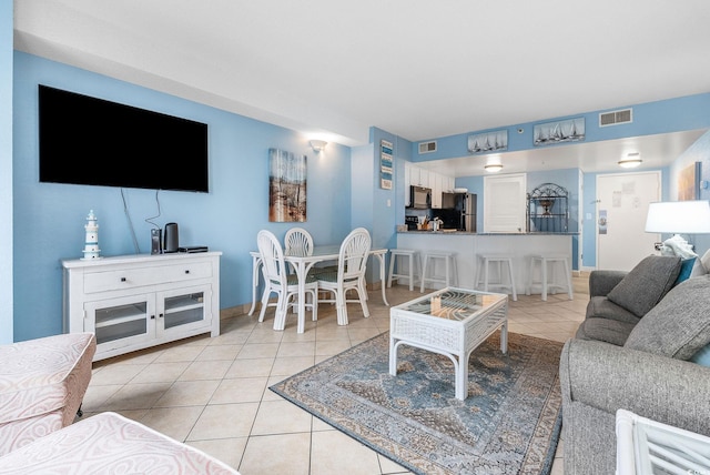 living room featuring light tile patterned flooring