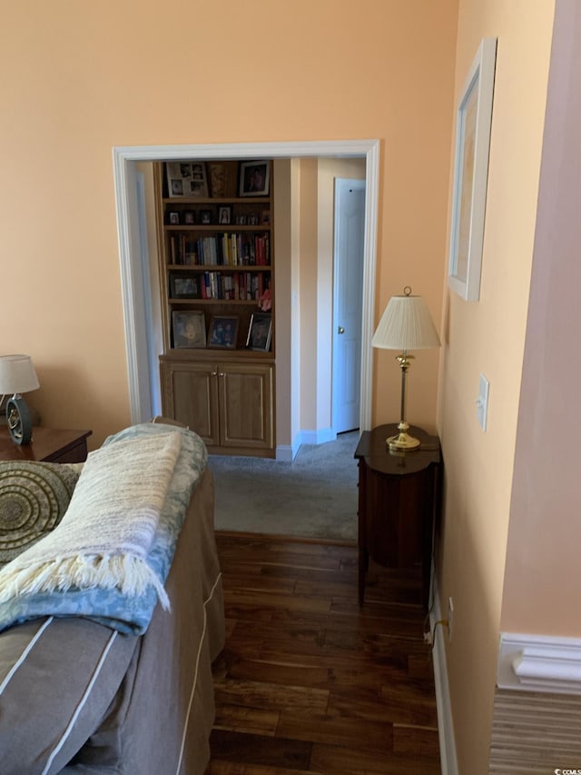 hall with dark hardwood / wood-style floors