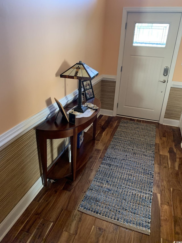 doorway to outside with dark hardwood / wood-style floors