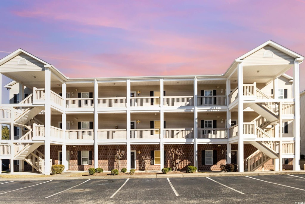 view of outdoor building at dusk