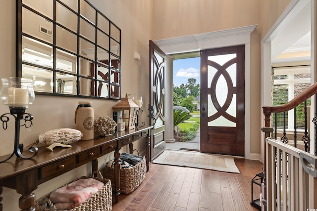 entrance foyer with hardwood / wood-style floors and a healthy amount of sunlight