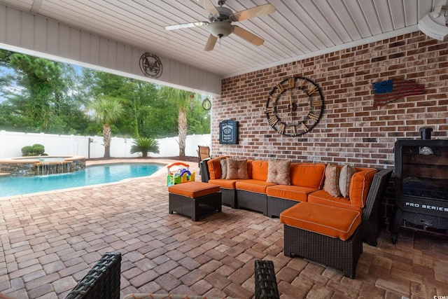 view of patio / terrace featuring an in ground hot tub, ceiling fan, and an outdoor hangout area