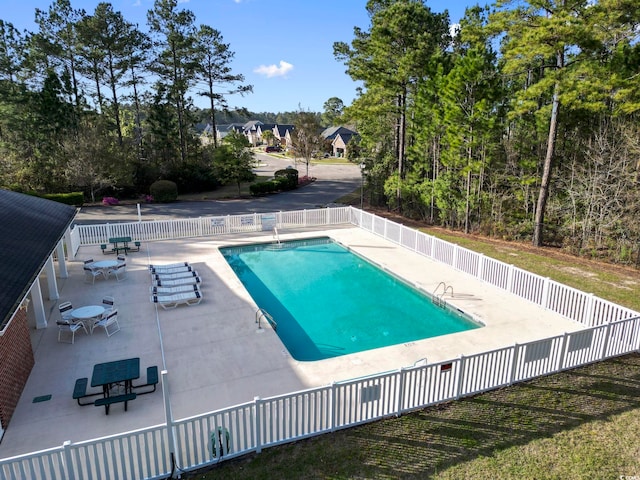 view of swimming pool with a patio