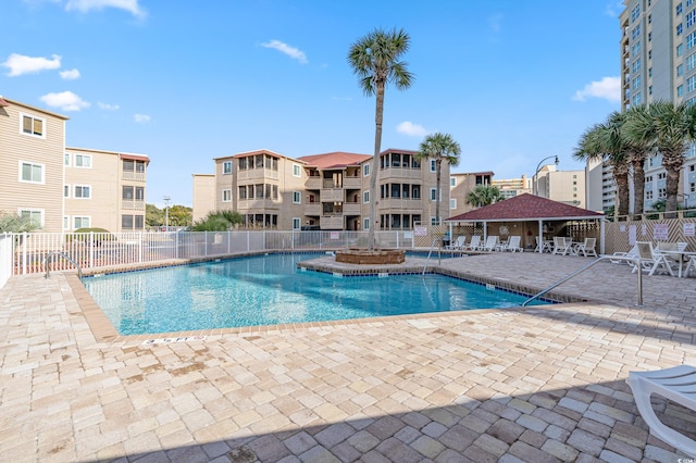 view of swimming pool with a patio area