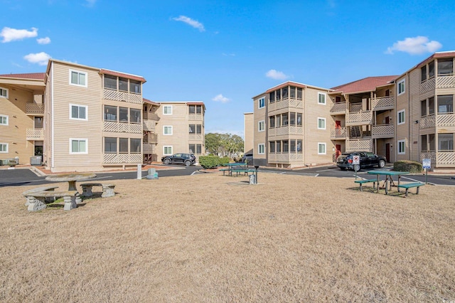 view of property's community featuring a yard