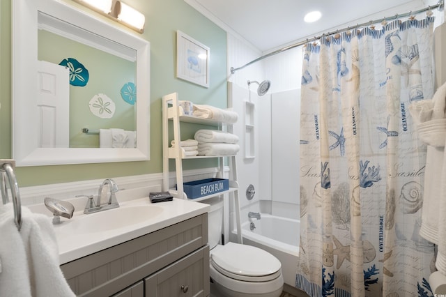 full bathroom featuring ornamental molding, shower / tub combo with curtain, vanity, and toilet