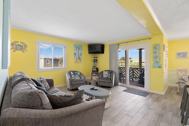 living room with a healthy amount of sunlight and ornamental molding