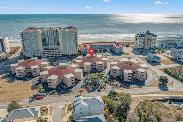 bird's eye view with a view of the beach and a water view