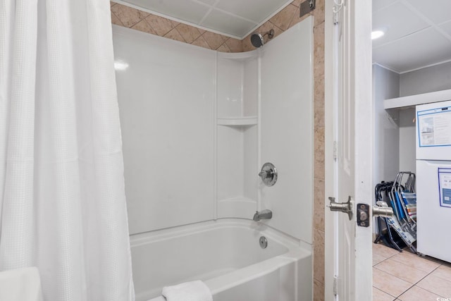 bathroom with shower / bath combo with shower curtain and tile patterned flooring