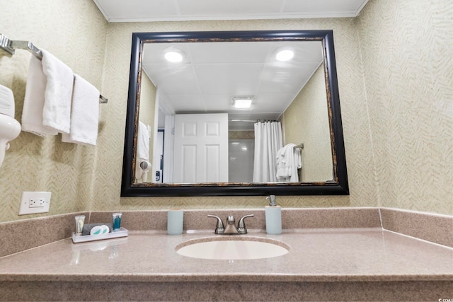 bathroom with a shower with curtain and vanity