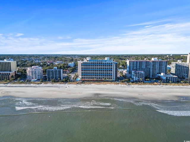 drone / aerial view featuring a water view and a beach view