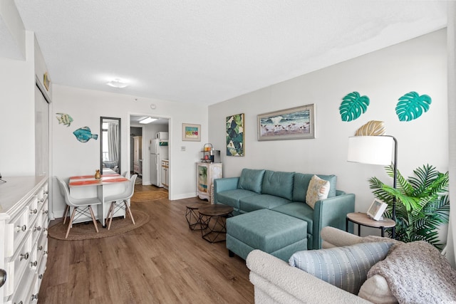 501 S Ocean Blvd Unit 708, North Myrtle Beach, SC 29582 - living room featuring wood finished floors and baseboards