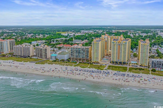 birds eye view of property featuring a view of the beach and a water view