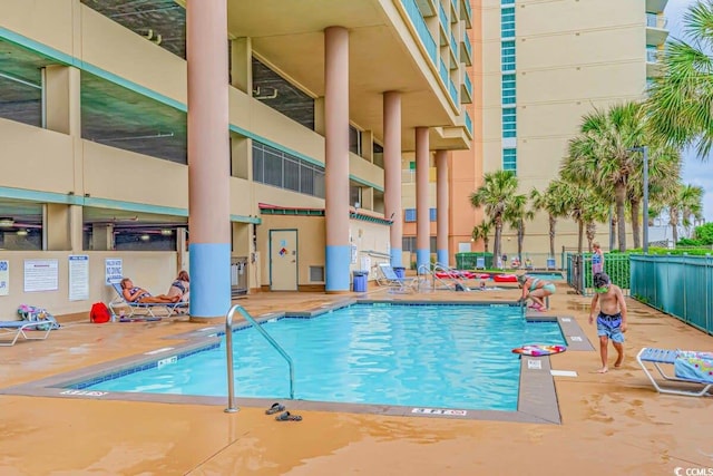 view of swimming pool with a patio area