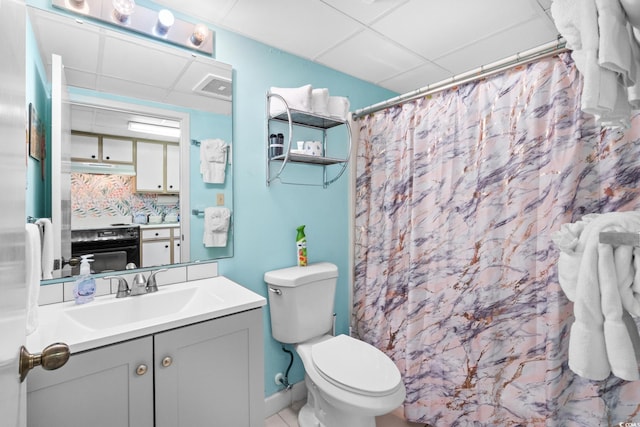 501 S Ocean Blvd Unit 708, North Myrtle Beach, SC 29582 - full bathroom featuring a drop ceiling, vanity, toilet, and a shower with curtain