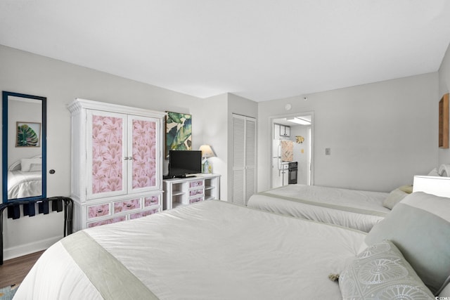 501 S Ocean Blvd Unit 708, North Myrtle Beach, SC 29582 - bedroom featuring dark wood finished floors and a closet
