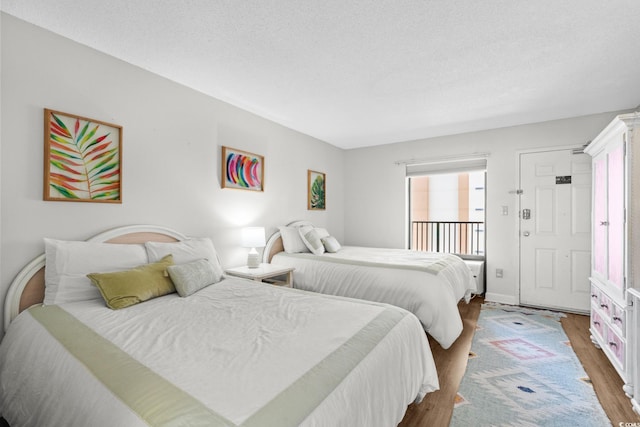 501 S Ocean Blvd Unit 708, North Myrtle Beach, SC 29582 - bedroom with wood finished floors and baseboards