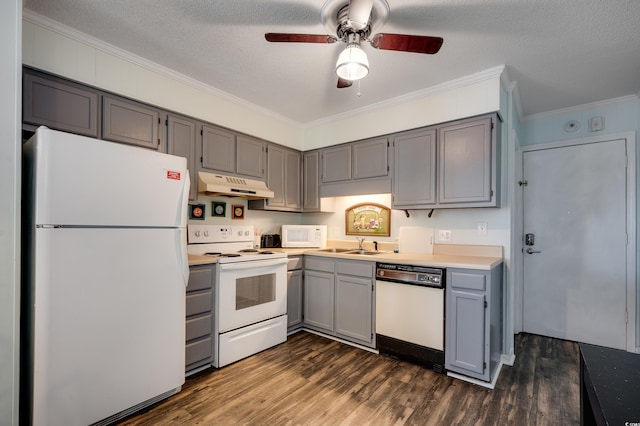 kitchen with ceiling fan, dark wood-type flooring, crown molding, a textured ceiling, and white appliances