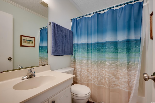 bathroom with vanity, a textured ceiling, toilet, and ornamental molding